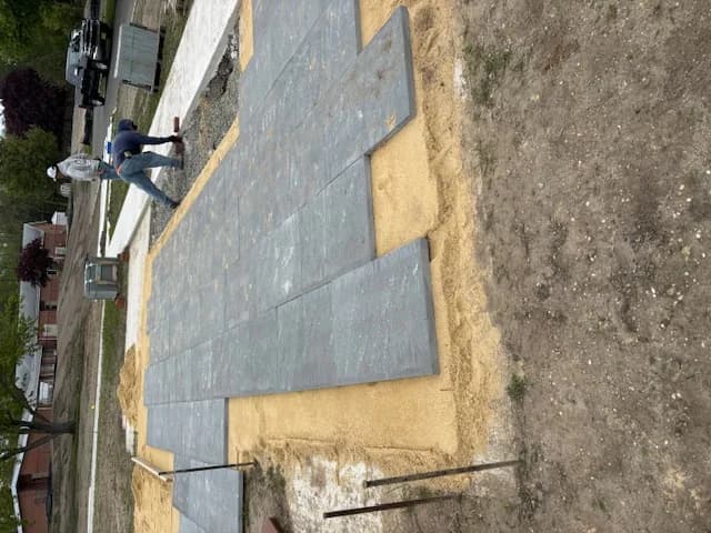 Charcoal running-bond paver patio being installed in Galloway, NJ